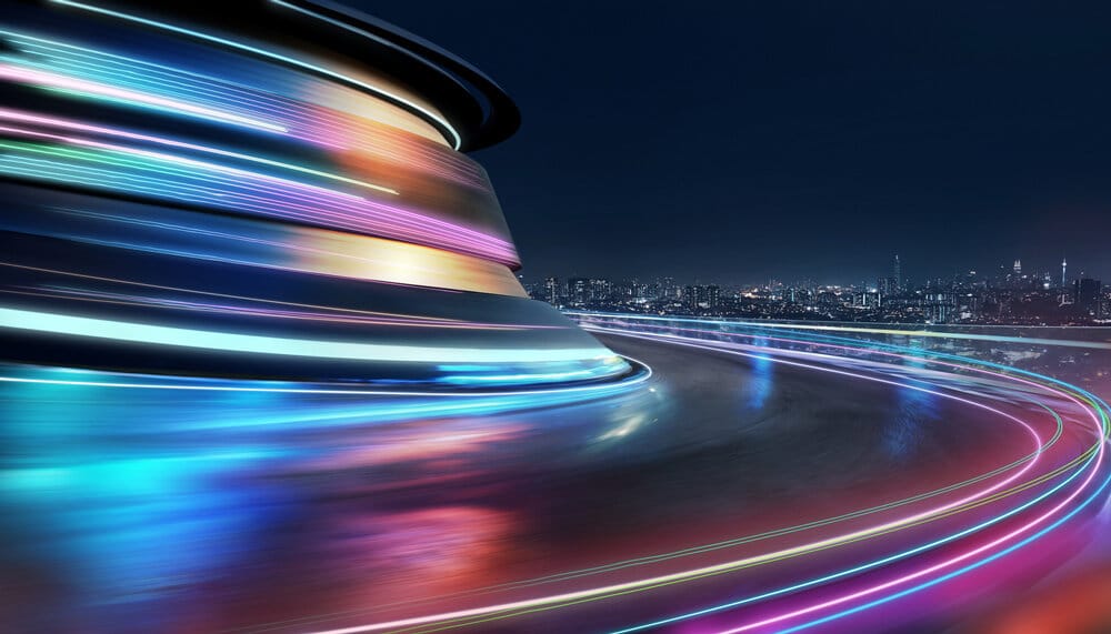 Long exposure of traffic in motion with dynamic light streaks representing speed