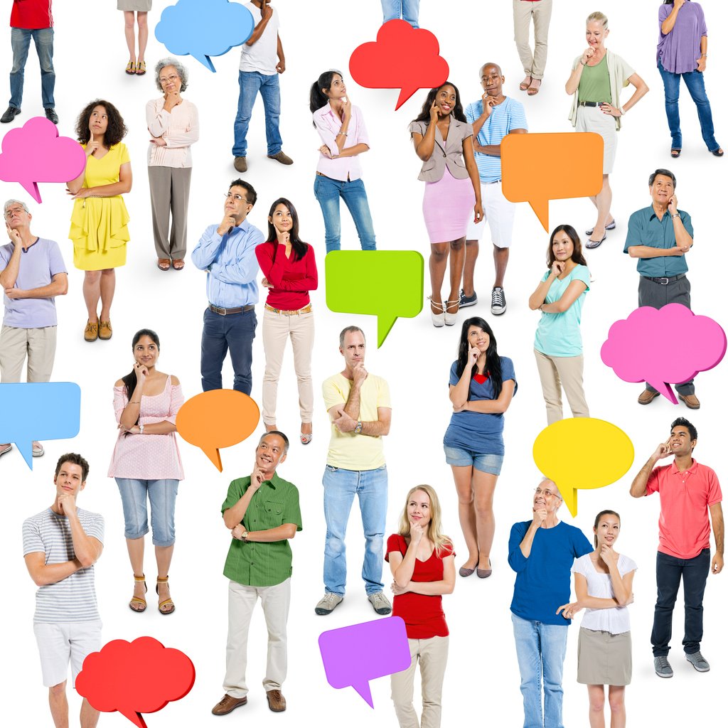 Diverse group of people with speech bubbles indicating communication